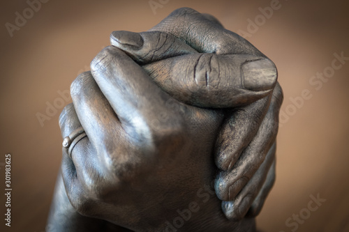 Close up of isolated hands of a man and a woman symbolizing team work and support