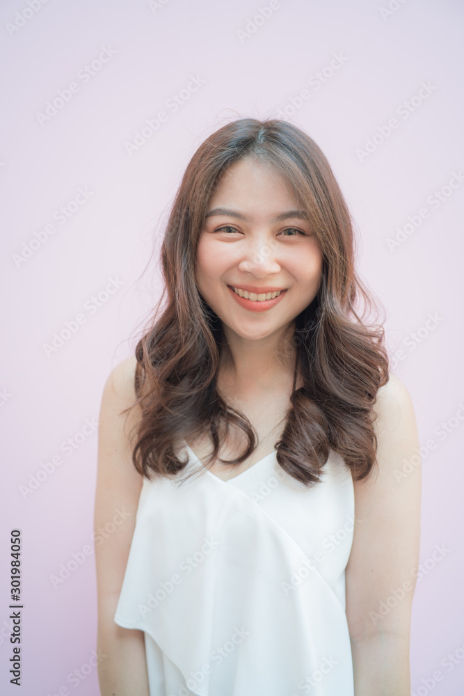 Beautiful asian women portrait posting on pink background Beautiful asian women portrait posting on pink background