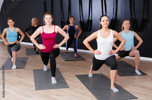 Women training in yoga studio