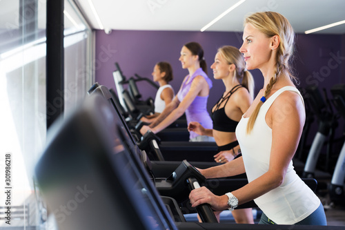 Women running on treadmills