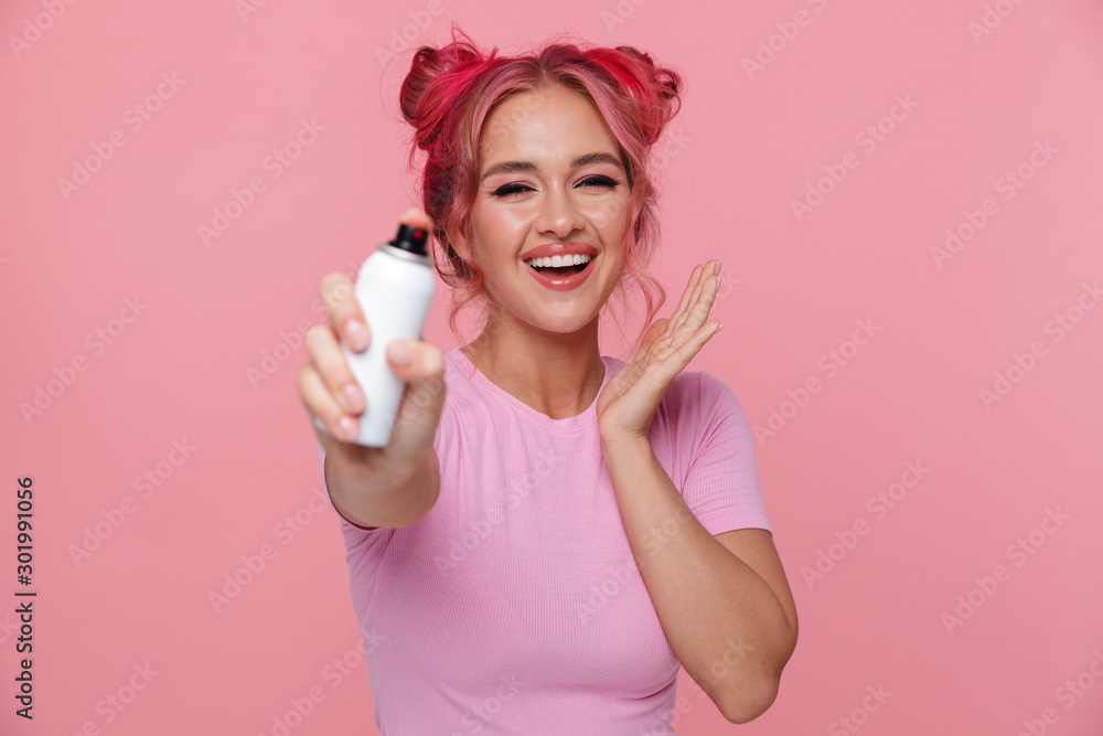 Portrait of happy woman smiling and dying her hair with color spray Portrait of happy woman smiling and dying her hair with color spray