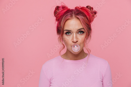 Fotografie Portrait of attractive young woman in t-shirt with colored hair chewing gum