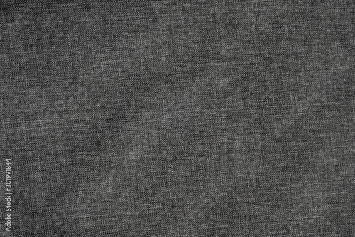 Background of dense gray-black fabric with wicker texture