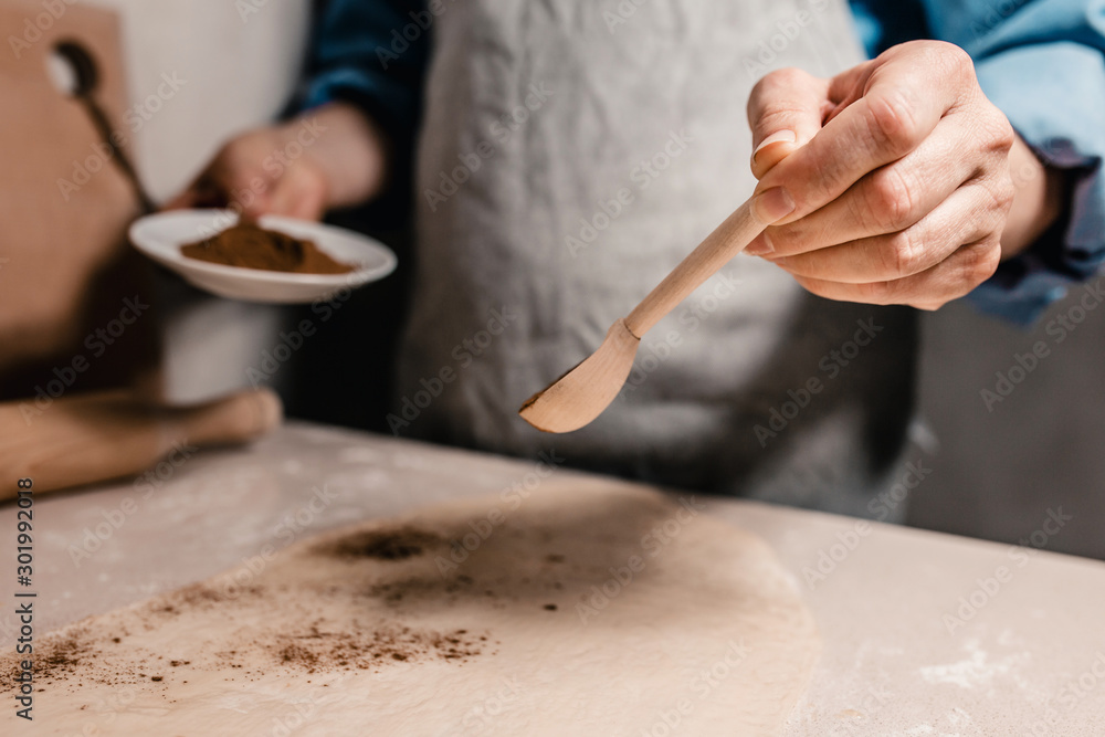 Roll out the dough on a cookie-making table - home rustic kitchen and cooking sweets Roll out the dough on a cookie-making table - home rustic kitchen and cooking sweets