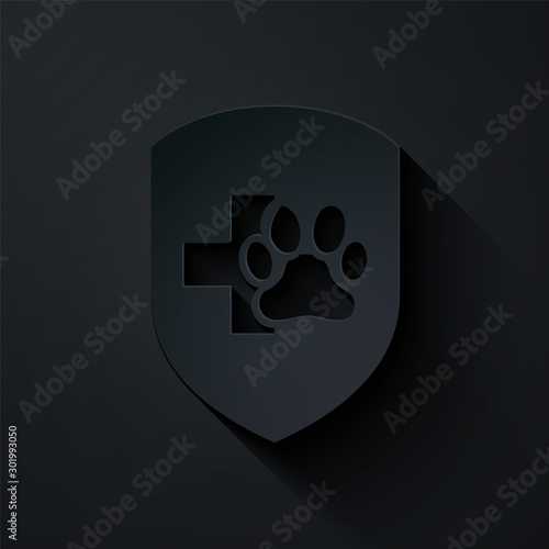 Paper cut Animal health insurance icon isolated on black background. Pet protection icon. Dog or cat paw print. Paper art style. Vector Illustration