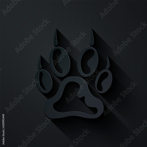 Paper cut Paw print icon isolated on black background. Dog or cat paw print. Animal track. Paper art style. Vector Illustration