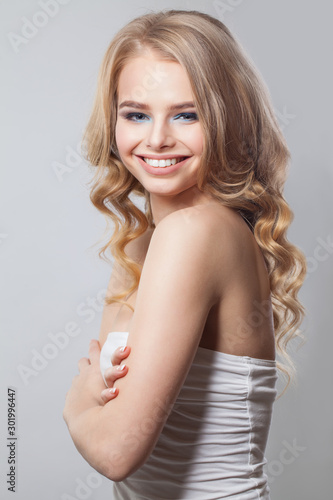 Beautiful happy woman smiling on white