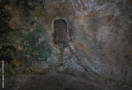 Niche hollowed in the wall for ritual candles in the Tomb of the Prophets on the Mount Eleon - Mount of Olives in East Jerusalem in Israel photo