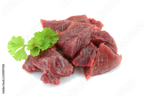 pieces of raw beef on a white background