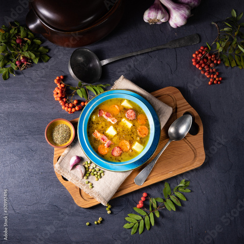 polish pea soup (grochowka) with smoked bacon and sausage photo