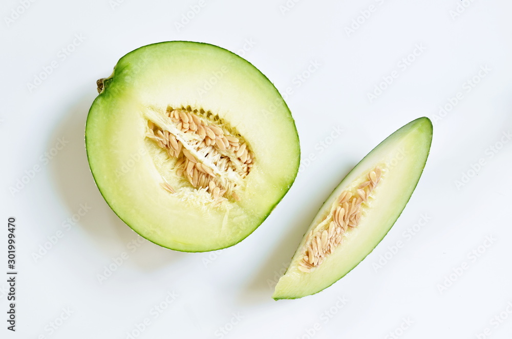 Japanese green melon cutting for piece on white background Japanese green melon cutting for piece on white background