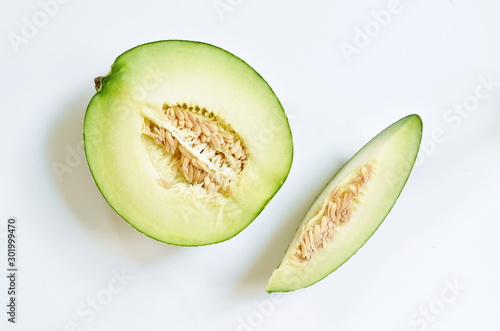 Japanese green melon cutting for piece on white background