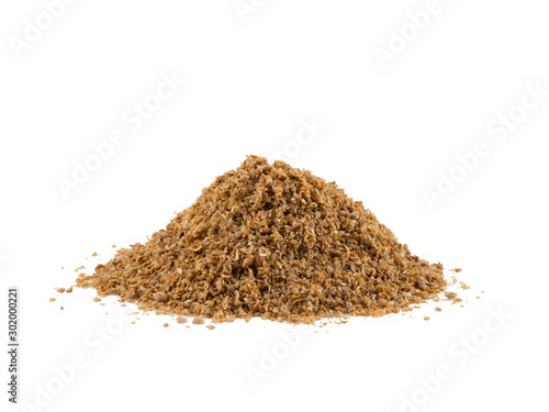 Small pile of a ground coriander isolated on white background with copy space for text or images. Spices and herbs. Packaging concept. Close-up.