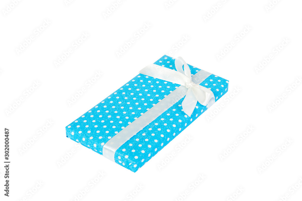 Christmas or other holiday handmade present in blue paper with white ribbon. Isolated on white background, top view. thanksgiving Gift box concept Christmas or other holiday handmade present in blue paper with white ribbon. Isolated on white background, top view. thanksgiving Gift box concept