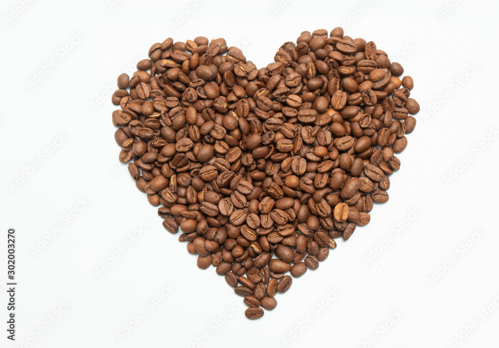 Roasted coffee beans in heart shape, love coffee concept, isolated on white Roasted coffee beans in heart shape, love coffee concept, isolated on white