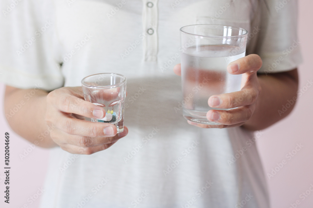 People carrying medicine and a glass of water People carrying medicine and a glass of water