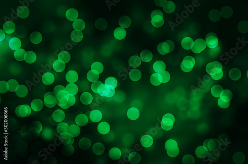 Dark green abstract background with bokeh