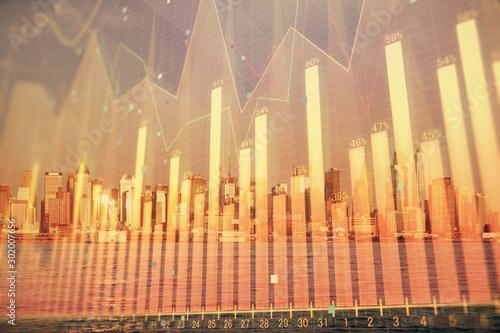 Forex chart on cityscape with tall buildings background multi exposure. Financial research concept.