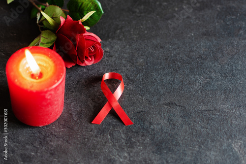 World aids day December 1 with red ribbon, campaign help people with living with HIV. photo