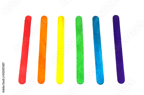 Popsicle sticks rainbow color isolated white background - LGBT pride flag patterns include of Lesbian, gay, bisexual, and transgender flag of LGBT organization.