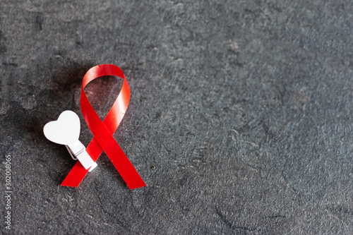 World aids day December 1 with red ribbon, campaign help people with living with HIV. photo