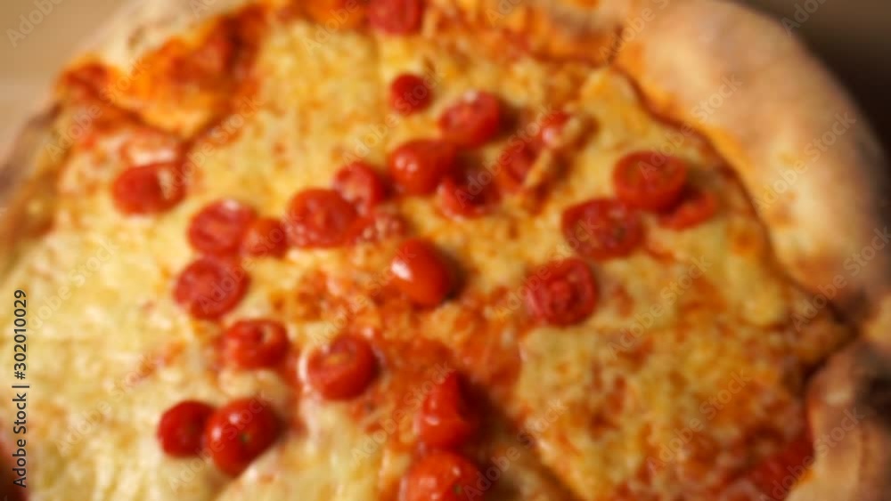 Homemade pizza with tomatoes,slow motion, zooming in Homemade pizza with tomatoes,slow motion, zooming in
