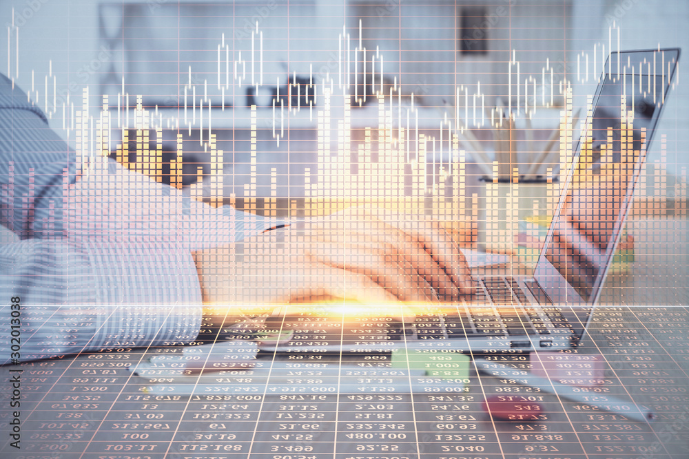 Double exposure of stock market graph with man working on laptop on background. Concept of financial analysis. Double exposure of stock market graph with man working on laptop on background. Concept of financial analysis.