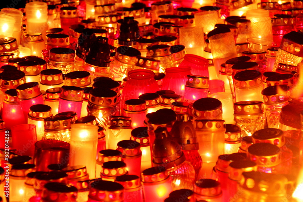 Candles in red and white color in the night. November 11th, Latvia celebrate Lacplesa day Candles in red and white color in the night. November 11th, Latvia celebrate Lacplesa day