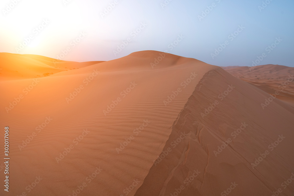 The beauty of the sand dunes in the Sahara Desert in Morocco. The Sahara Desert is the largest hot desert and one of the harshest environments in the world.