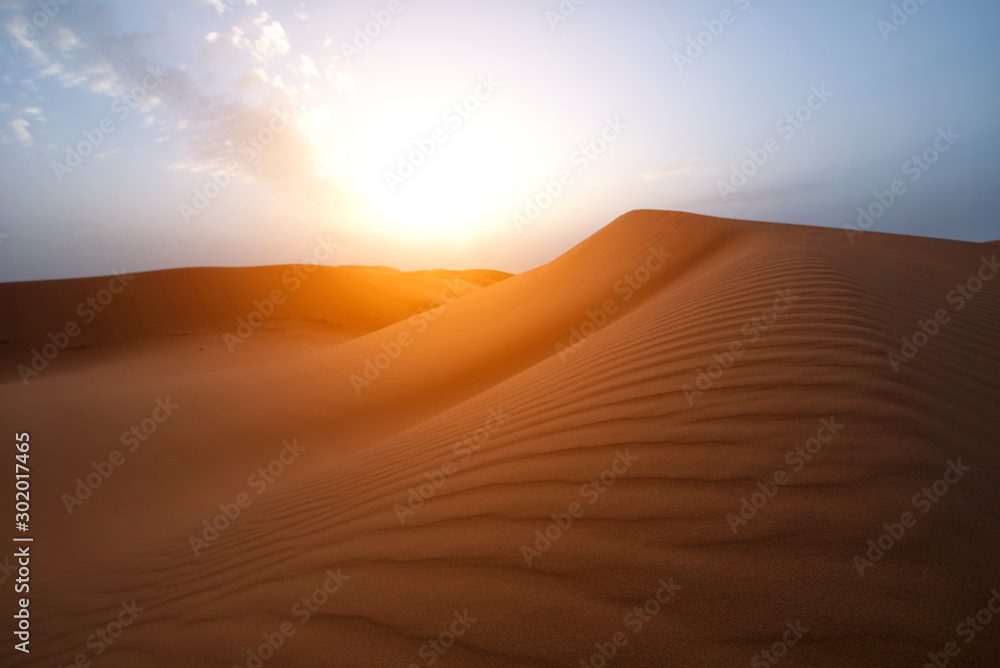 The beauty of the sand dunes in the Sahara Desert in Morocco. The Sahara Desert is the largest hot desert and one of the harshest environments in the world.