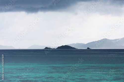 Beautiful seascape of tropical island with blue sea and mountain beach in cloud storm at Koh Lipe in Satul Province, Thailand