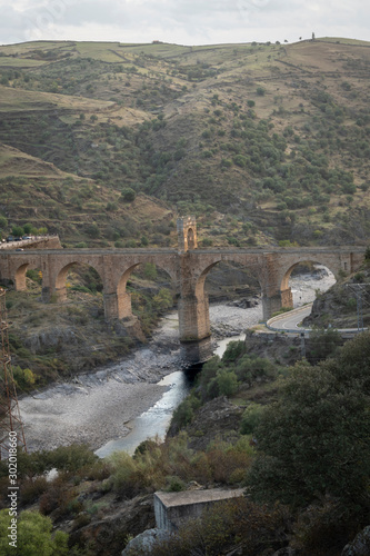 Roman bridge of Alcantara in arch built between 103 and 104. It crosses the Tajo river.