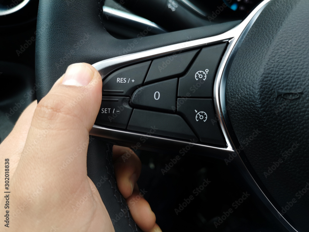 cruise control button on the steering wheel