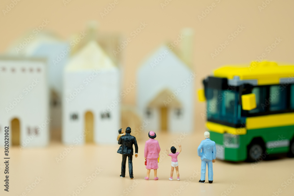 Fototapeta premium Miniature people : Children, students going to school with school bus