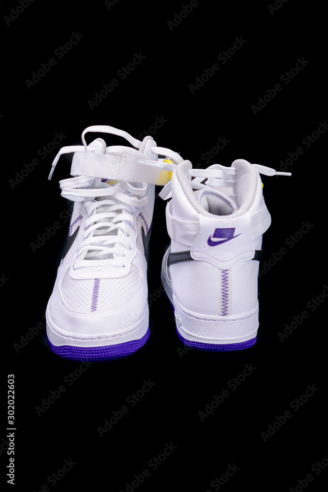 A modern take on the classic Nike Air Force 1 High Top Basketball shoes  sneakers with purple and yellow touches with leather and mesh combination  Stock Photo | Adobe Stock