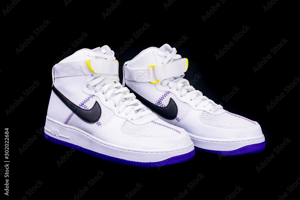 A modern take on the classic Nike Air Force 1 High Top Basketball shoes sneakers with purple yellow touches with leather and mesh combination de Stock Adobe Stock