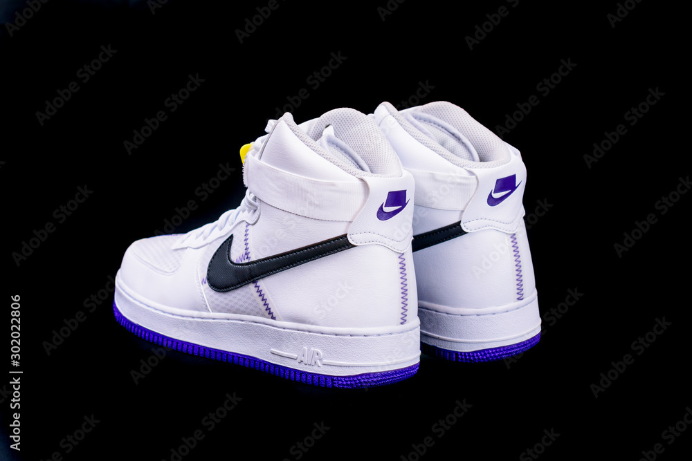 A modern take the classic Nike Air Force 1 High Top Basketball shoes sneakers with purple and yellow touches with leather and mesh combination foto de Stock | Stock