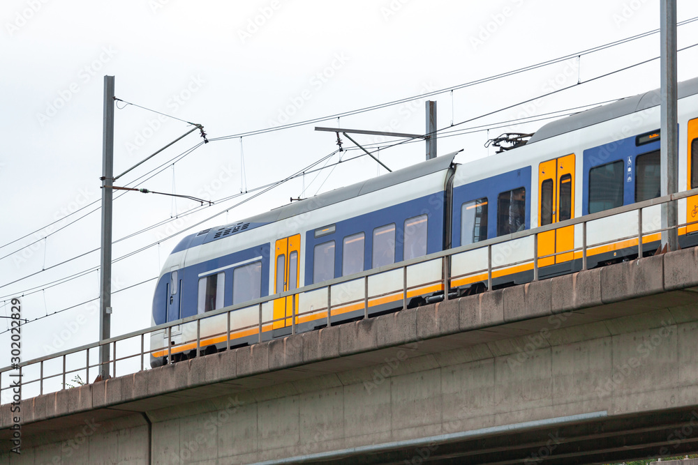 Fototapeta premium Skytrain in city Amsterdam. Passenger train in Netherlands.