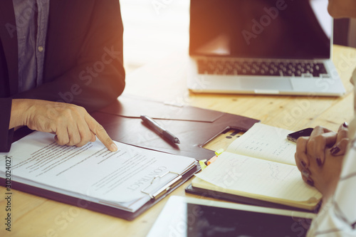Konstfotografi A businessman reading a business agreement before making an investment