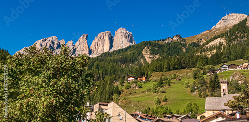 Beautiful alpine view with lots of paragliders near Vigo di Fassa, South Tyrol, Italy photo