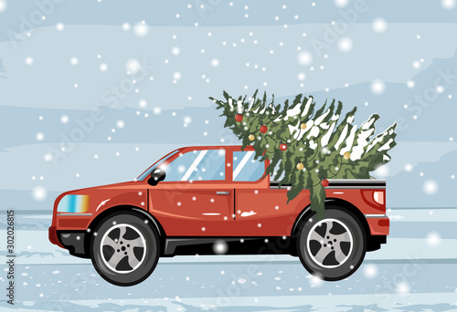 Red car carrying evergreen fir tree covered in snow. Blizzard. Christmas holi...