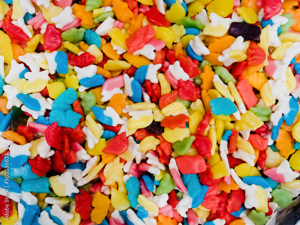 Abstract background of mixed marmalade. A lot of multi-colored chewing sweets, top view Abstract background of mixed marmalade. A lot of multi-colored chewing sweets, top view