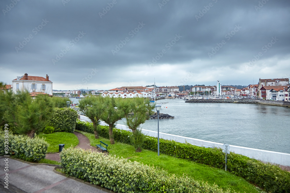 Saint-Jean-de-Luz / Ciboure (France). French Basque country. River La  Nivelle. Coastal town on the shore of the Bay of Biscay in cloudy weather  day with grey sky Stock Photo | Adobe Stock