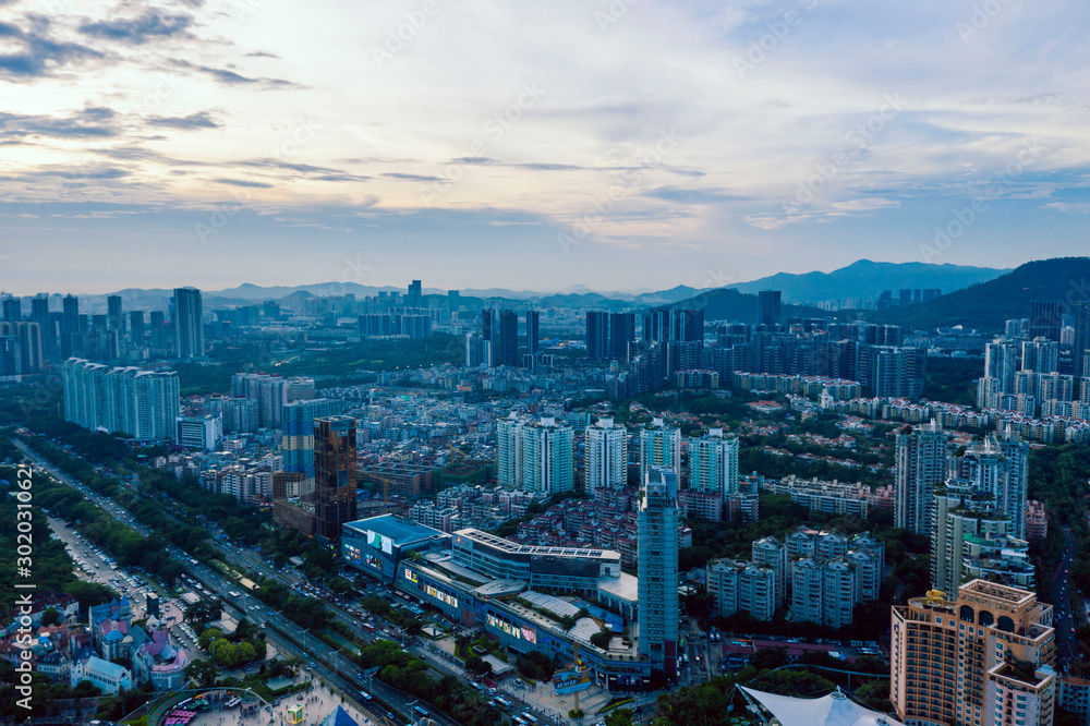 An aerial wide-angle view on sunset cityscape at nanshan district of shenzhen china