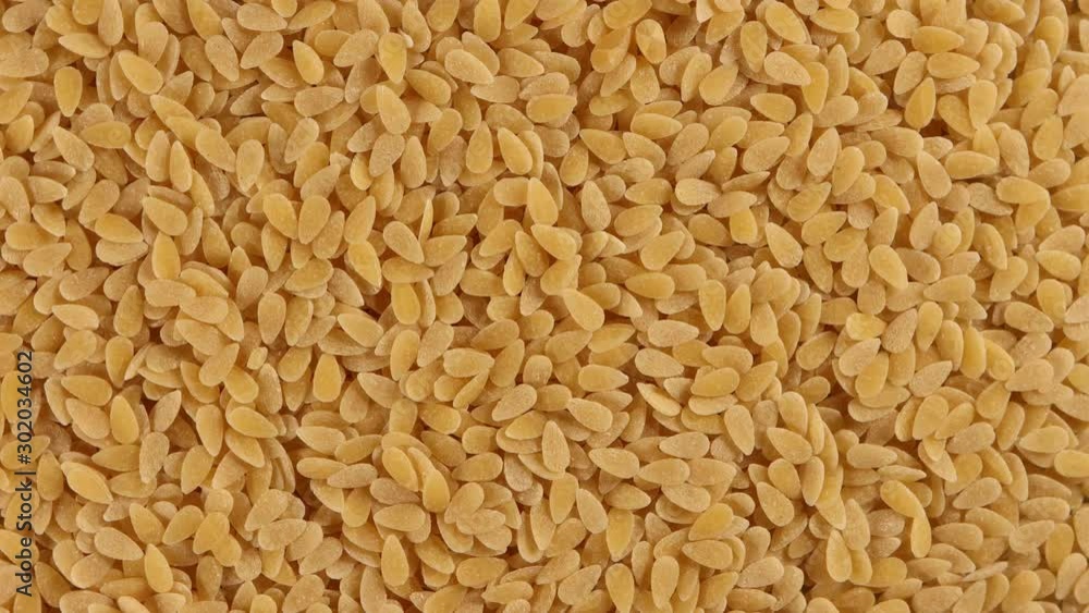 Dried watermelon seeds 4k video spinning clockwise slowly top down view Dried watermelon seeds 4k video spinning clockwise slowly top down view