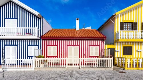 Street with colorful houses in Costa Nova, Aveiro, Portugal. Street with striped houses, Costa Nova, Aveiro, Portugal. Facades of colorful houses in Costa Nova, Aveiro, Portugal.