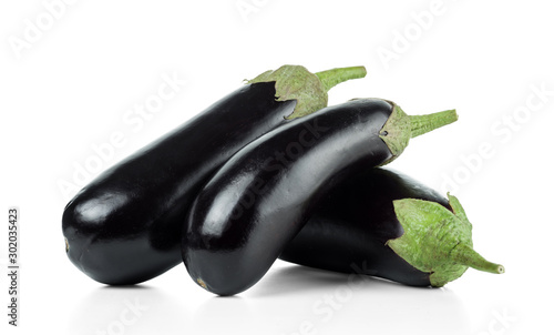 Three black ripe long purple eggplants. Isolated on white background.