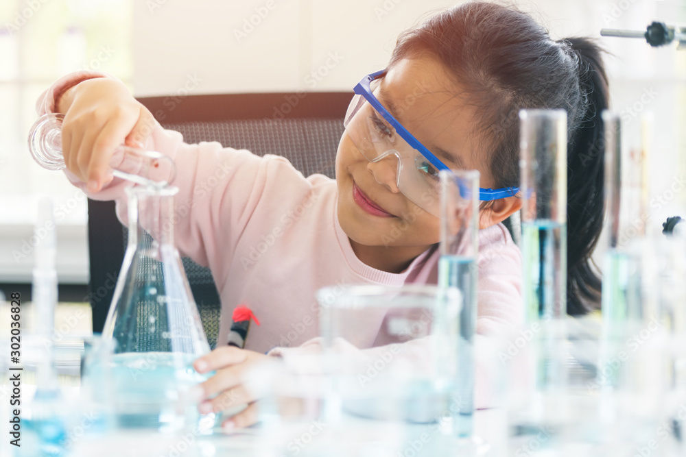 little asia kids girl in lab learning chemistry in. little asia kids girl in lab learning chemistry in.