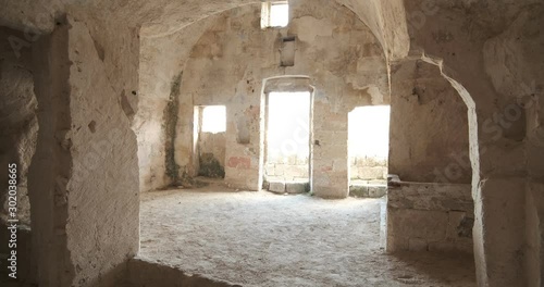 Sassi of Matera with arched ceilings and vaults. Doors and windows in an ancient underground house dug out of the tufa rock.
