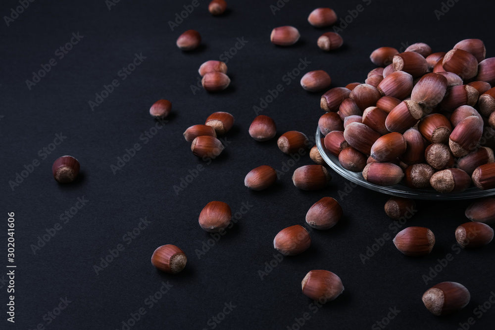 Obraz premium Hazelnut isolated on black background. Set or collection.